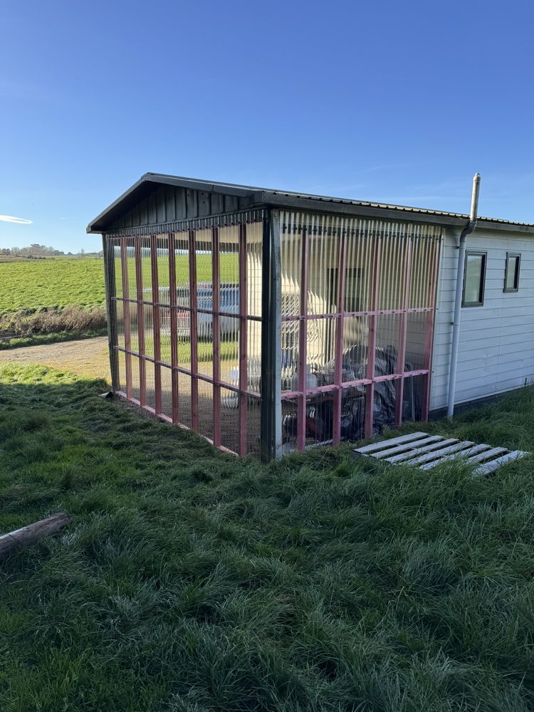 Large catio enclosure built onto the end of a building